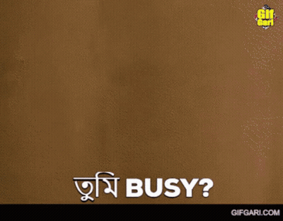 A Man Is Standing In Front Of A Wall And Says " Busy " In A Foreign Language GIF