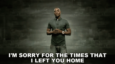 A Man Is Standing In Front Of A Wall With The Words I 'M Sorry For The Times That I Left You Home Below Him GIF