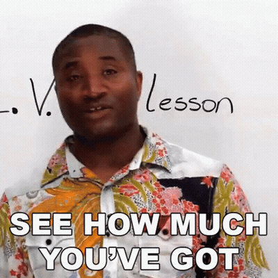 A Man Is Standing In Front Of A White Board With The Word Lesson Written On It GIF