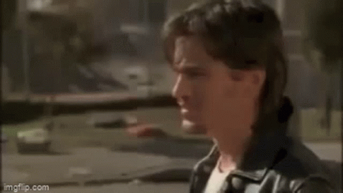 A Man Is Standing In Front Of A Window And Saying `` I 'D Say When The Angels Win The Pennant '' GIF