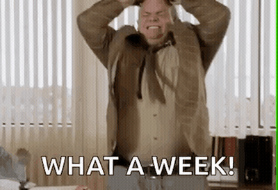 A Man Is Standing In Front Of A Window With His Hands On His Head And Screaming . GIF