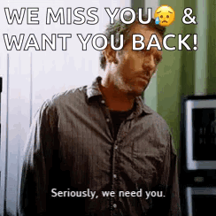 A Man Is Standing In Front Of A Window With The Words `` We Miss You And Want You Back '' Written On It . GIF