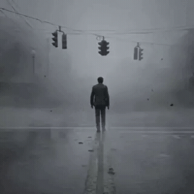A Man Is Standing In The Middle Of A Foggy Street . GIF
