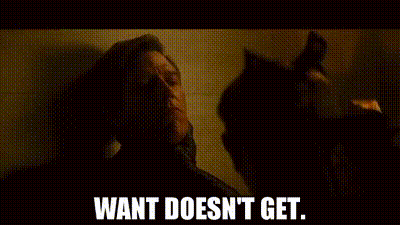 A Man Is Standing Next To A Cat In A Dark Room And Says `` Want Does N't Get . '' GIF