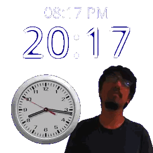 A Man Is Standing Next To A Clock That Says 20:17 Sticker