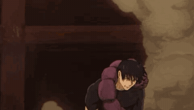 A Man Is Standing Next To A Purple Worm . GIF