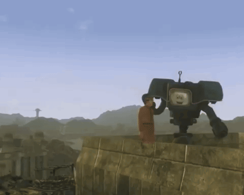 A Man Is Standing Next To A Robot That Has A Face On It GIF