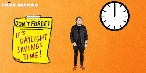 A Man Is Standing Next To A Yellow Sign That Says " Do N't Forget It 'S Daylight Savings Time " GIF