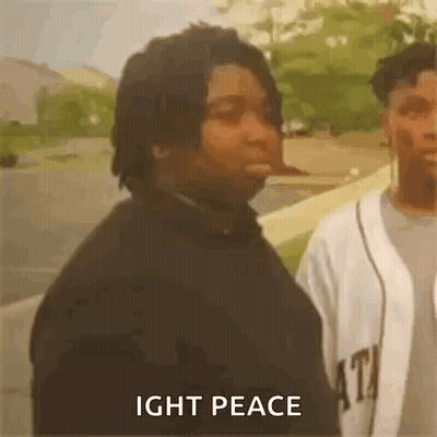 A Man Is Standing Next To Another Man With The Words `` Ight Peace '' Written On The Screen . GIF