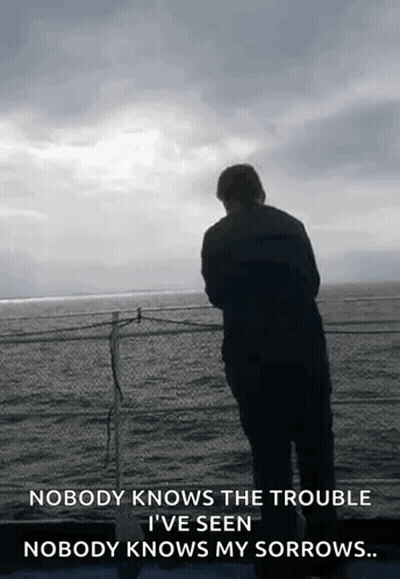 A Man Is Standing On A Balcony Overlooking The Ocean With A Quote That Says Nobody Knows The Trouble GIF