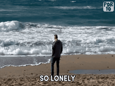 A Man Is Standing On A Beach With The Words So Lonely Behind Him GIF