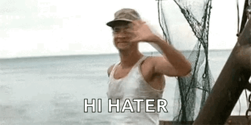 A Man Is Standing On A Boat In The Ocean Waving His Hand . GIF