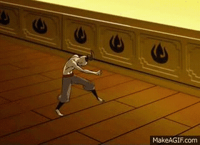 A Man Is Standing On A Wooden Floor In A Room . GIF