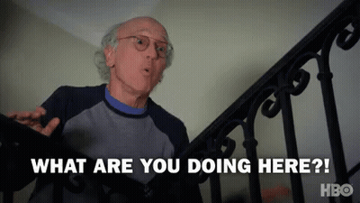 A Man Is Standing On Top Of A Set Of Stairs And Asking What Are You Doing Here ? GIF