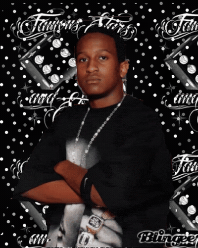 A Man Is Standing With His Arms Crossed In Front Of A Background That Says Famous Stars GIF