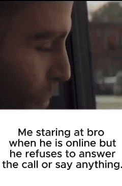 A Man Is Staring Out Of A Window While Talking On A Phone . GIF