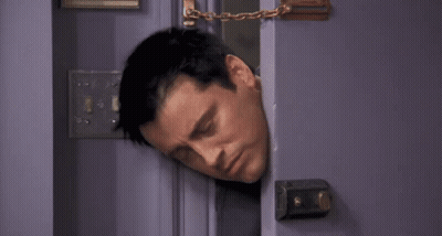 A Man Is Sticking His Head Out Of A Door With The Words I 'M Stuck Below Him . GIF