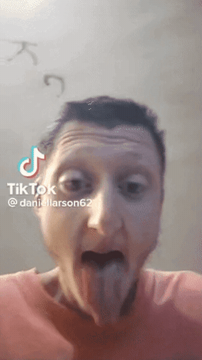 A Man Is Sticking His Tongue Out In A Tik Tok Video Taken By Daniellarson62 GIF