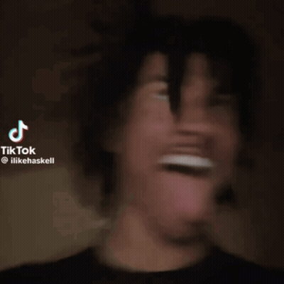 A Man Is Sticking His Tongue Out In A Tik Tok GIF