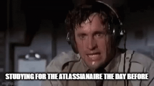 A Man Is Sweating While Wearing Headphones And Looking At The Camera . GIF