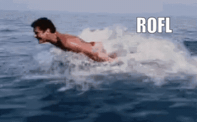 A Man Is Swimming In The Ocean With The Word Rofl Above Him GIF