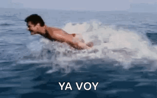 A Man Is Swimming In The Ocean With The Words Ya Voy In The Corner . GIF