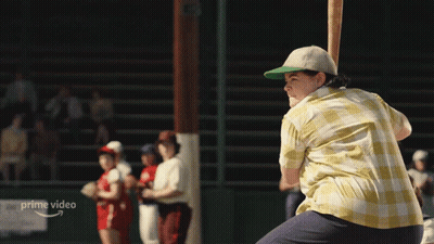 A Man Is Swinging A Baseball Bat In Front Of A Sign That Says " Prime Video " GIF