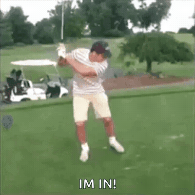 A Man Is Swinging A Golf Club On A Golf Course And The Words Im In Are Visible GIF