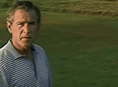 A Man Is Swinging A Golf Club On A Green GIF