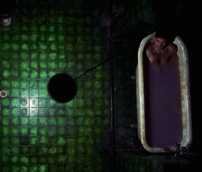 A Man Is Taking A Bath In A Bathtub With Purple Liquid GIF