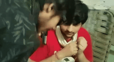 A Man Is Taking A Man 'S Blood Pressure With A Thermometer In His Hand . GIF