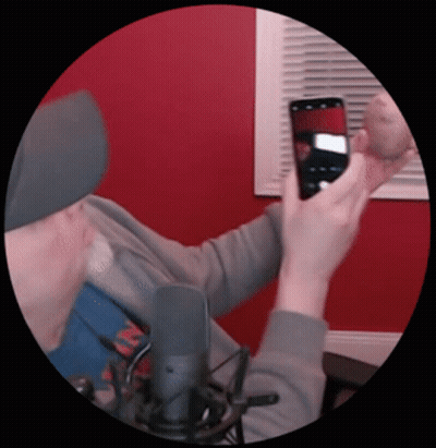 A Man Is Taking A Picture Of Himself With His Cell Phone GIF
