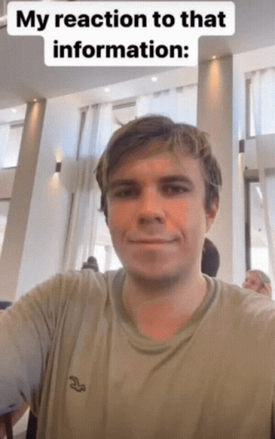 A Man Is Taking A Selfie With A Caption That Says " My Reaction To That Information " GIF