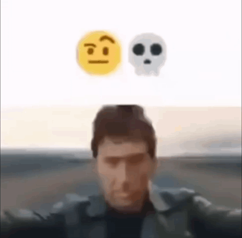 A Man Is Taking A Selfie With A Skull And A Smiley Face Above Him . GIF
