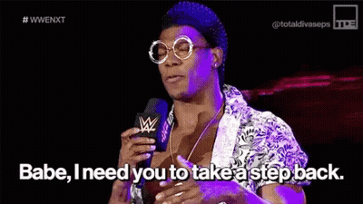 A Man Is Talking Into A Microphone And Saying Babe I Need You To Take A Step Back GIF