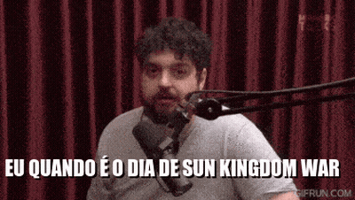 A Man Is Talking Into A Microphone With The Words Eu Quando E O Dia De Sun Kingdom War Written Below Him GIF