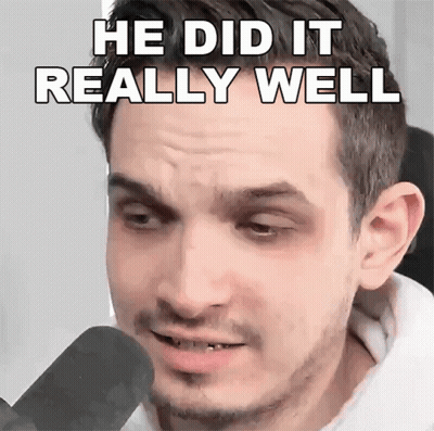 A Man Is Talking Into A Microphone With The Words He Did It Really Well Written On His Face . GIF
