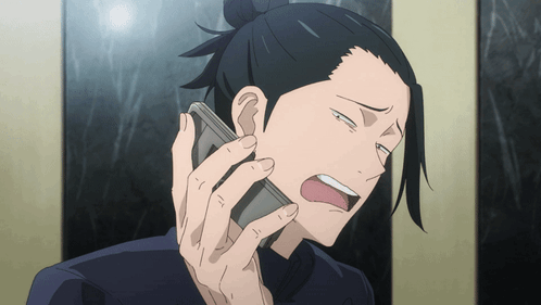A Man Is Talking On A Cell Phone And Making A Funny Face GIF