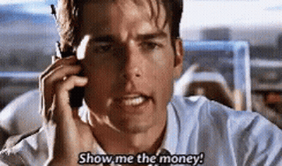 A Man Is Talking On A Cell Phone And Saying `` Show Me The Money ! '' GIF