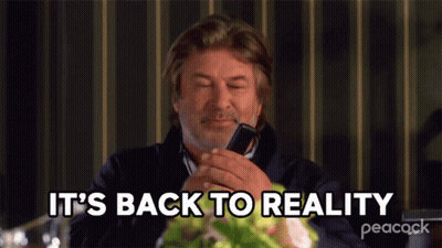 A Man Is Talking On A Cell Phone And The Words It 'S Back To Reality Are Above Him GIF