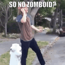 A Man Is Talking On A Cell Phone Next To A Fire Hydrant . GIF