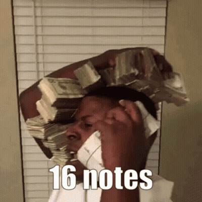 A Man Is Talking On A Cell Phone While Holding A Large Stack Of Money On His Head . GIF