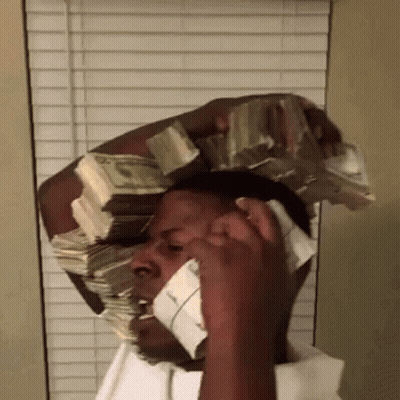 A Man Is Talking On A Cell Phone While Holding A Large Stack Of Money On His Head . GIF
