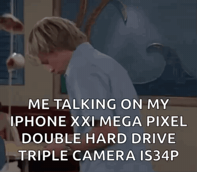 A Man Is Talking On A Cell Phone With A Double Hard Drive Triple Camera . GIF