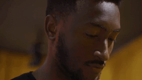 A Man Is Talking On A Cell Phone With The Word Hello Written Below Him GIF