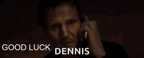 A Man Is Talking On A Cell Phone With The Words Good Luck Dennis Below Him GIF