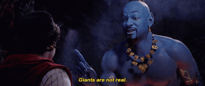A Man Is Talking To A Blue Genie Who Says " Giants Are Not Real " GIF