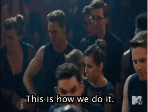 A Man Is Talking To A Group Of People And Says `` This Is How We Do It . '' GIF