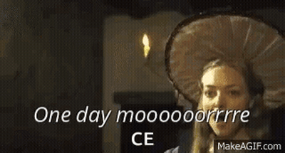 A Man Is Talking To A Woman In A Room With The Words `` One Day Mooooooorrre Ce '' Written On The Screen . GIF