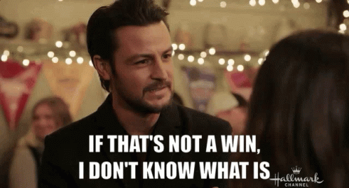 A Man Is Talking To A Woman With The Words If That 'S Not A Win I Don 'T Know What Is GIF